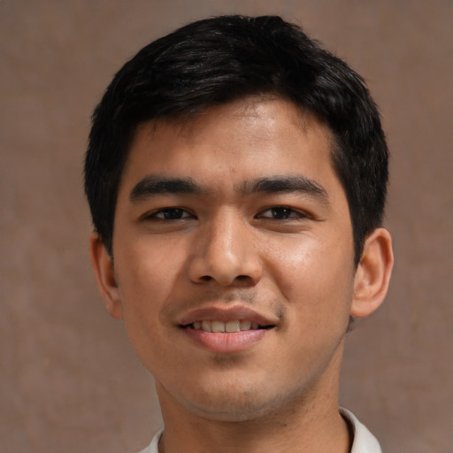 Joyful asian young-adult male with short  black hair and brown eyes