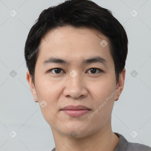 Joyful asian young-adult male with short  black hair and brown eyes