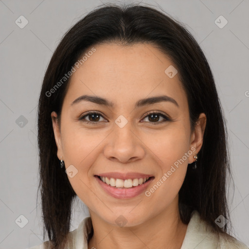 Joyful latino young-adult female with medium  brown hair and brown eyes