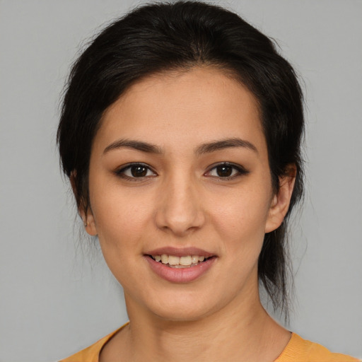 Joyful asian young-adult female with medium  brown hair and brown eyes
