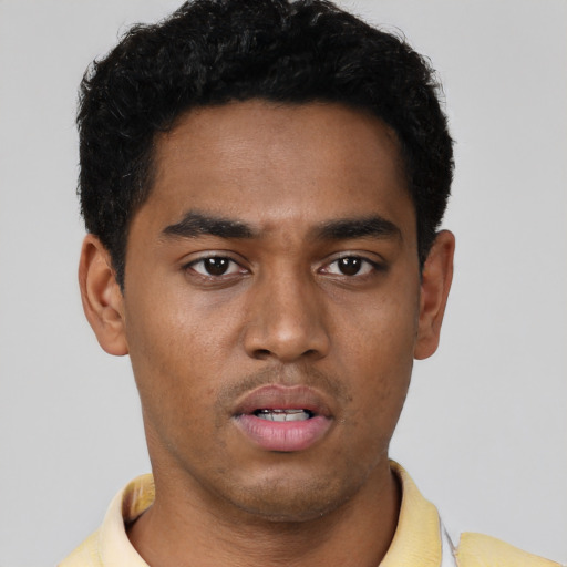 Neutral black young-adult male with short  black hair and brown eyes