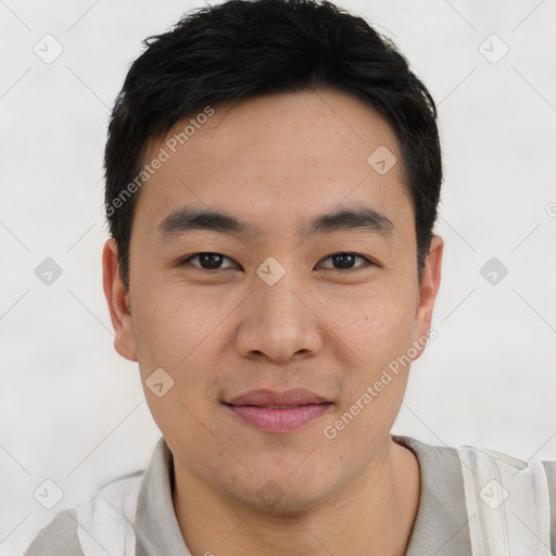 Joyful asian young-adult male with short  black hair and brown eyes