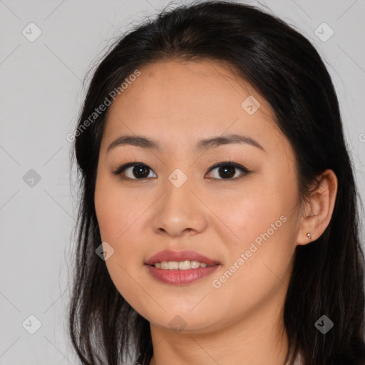 Joyful asian young-adult female with long  brown hair and brown eyes