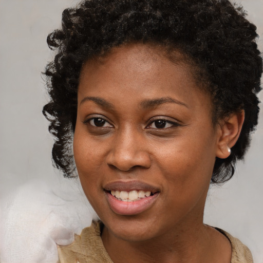 Joyful black young-adult female with medium  brown hair and brown eyes
