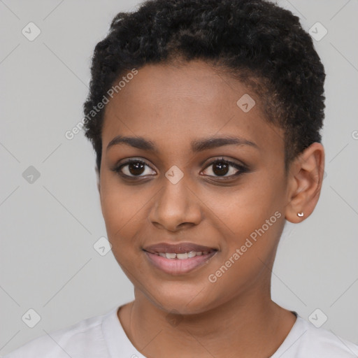 Joyful black young-adult female with short  black hair and brown eyes