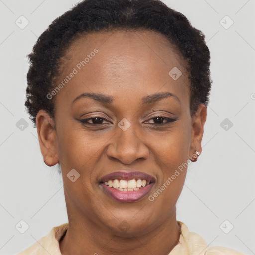 Joyful black young-adult female with short  brown hair and brown eyes