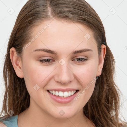 Joyful white young-adult female with long  brown hair and blue eyes