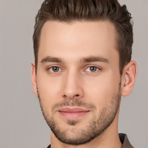 Joyful white young-adult male with short  brown hair and brown eyes