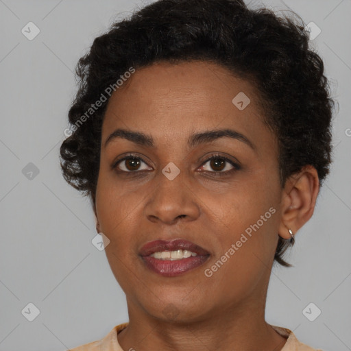 Joyful black young-adult female with short  brown hair and brown eyes