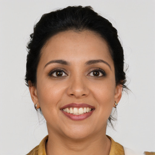 Joyful latino young-adult female with long  brown hair and brown eyes