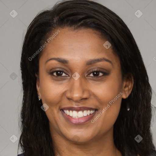 Joyful latino young-adult female with long  brown hair and brown eyes