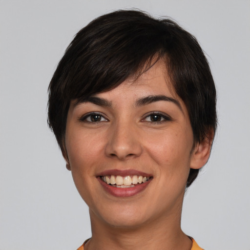 Joyful white young-adult female with short  brown hair and brown eyes