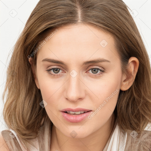 Joyful white young-adult female with long  brown hair and blue eyes