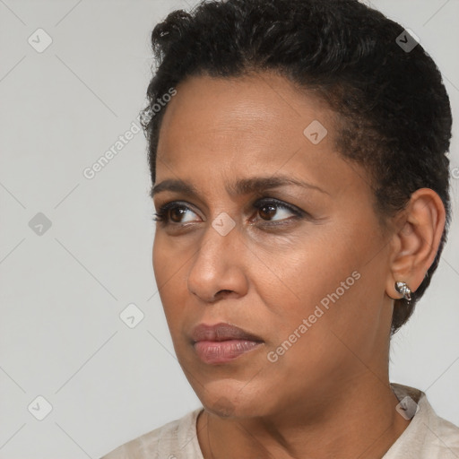 Joyful black adult female with short  brown hair and brown eyes