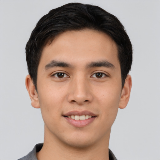 Joyful asian young-adult male with short  black hair and brown eyes