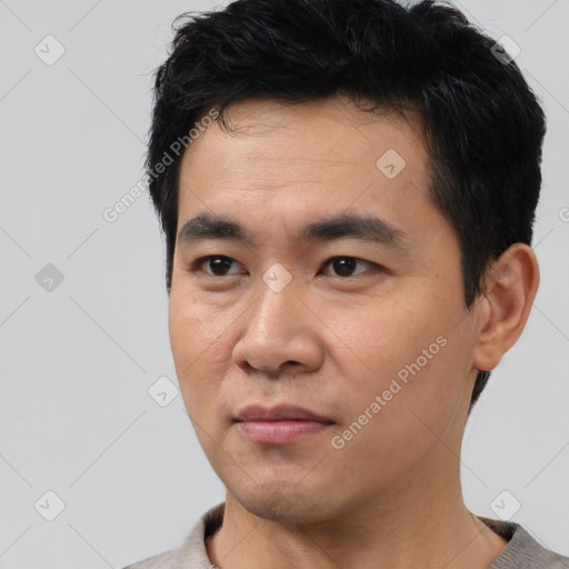 Neutral asian young-adult male with short  black hair and brown eyes