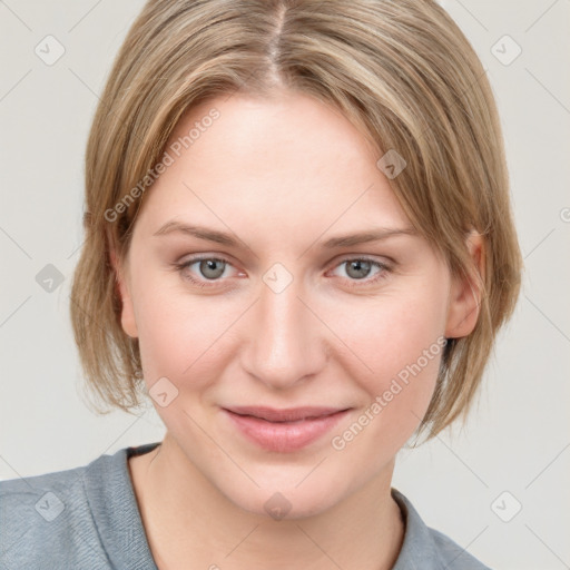 Joyful white young-adult female with medium  brown hair and blue eyes