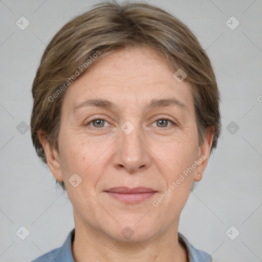 Joyful white adult female with medium  brown hair and grey eyes