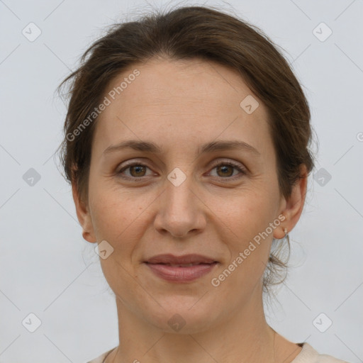 Joyful white adult female with short  brown hair and grey eyes