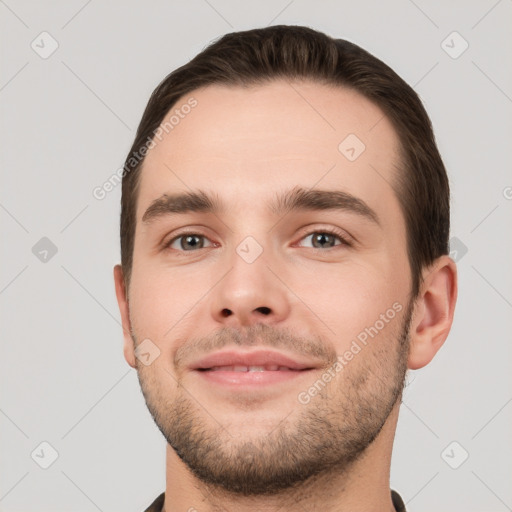 Joyful white young-adult male with short  brown hair and brown eyes