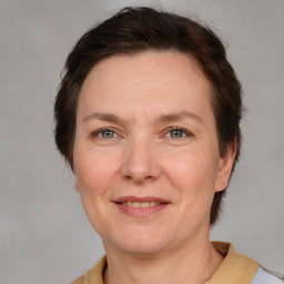 Joyful white adult female with medium  brown hair and brown eyes