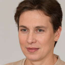 Joyful white adult female with short  brown hair and brown eyes