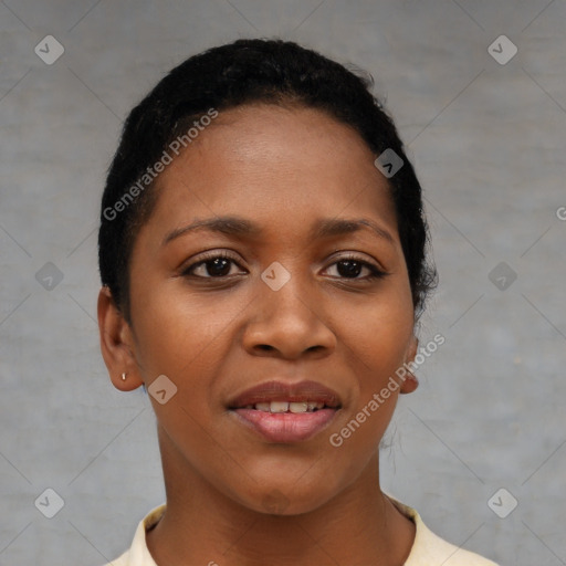 Joyful black young-adult female with short  black hair and brown eyes