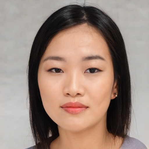 Neutral asian young-adult female with medium  black hair and brown eyes
