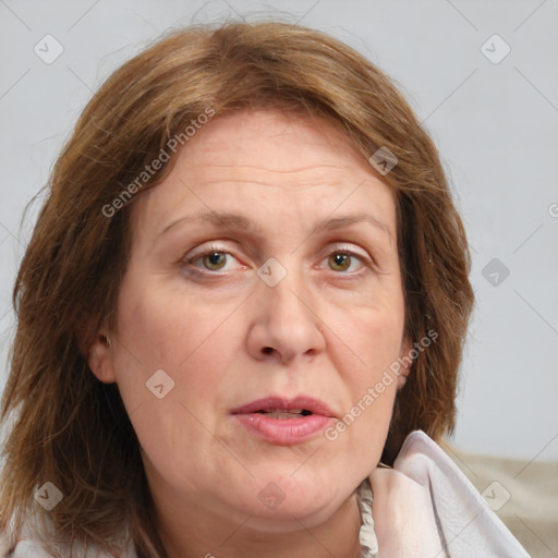 Joyful white adult female with medium  brown hair and green eyes