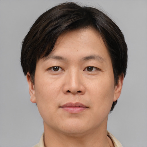 Neutral asian young-adult male with short  brown hair and brown eyes