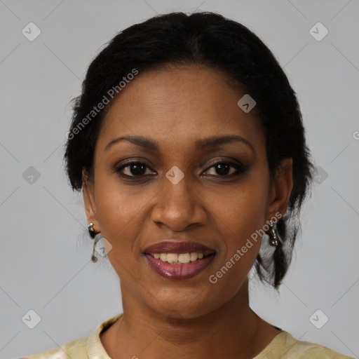 Joyful black young-adult female with short  black hair and brown eyes