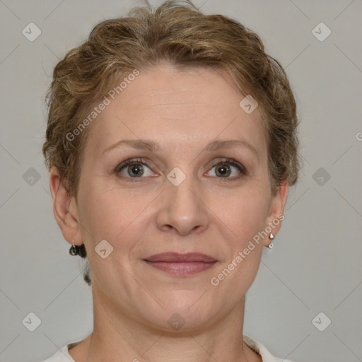 Joyful white adult female with short  brown hair and grey eyes