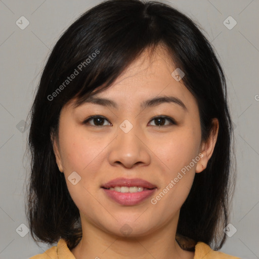 Joyful asian young-adult female with medium  brown hair and brown eyes