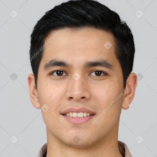 Joyful white young-adult male with short  black hair and brown eyes