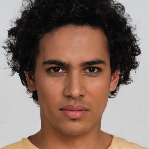 Neutral latino young-adult male with short  brown hair and brown eyes