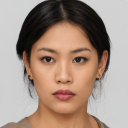 Neutral asian young-adult female with medium  brown hair and brown eyes