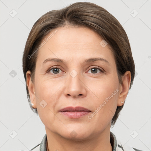 Joyful white adult female with short  brown hair and grey eyes