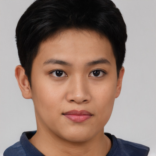 Joyful asian young-adult female with short  brown hair and brown eyes