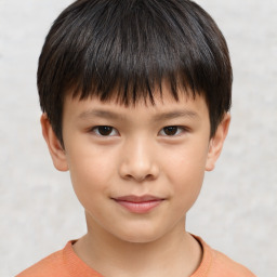 Joyful white child male with short  brown hair and brown eyes