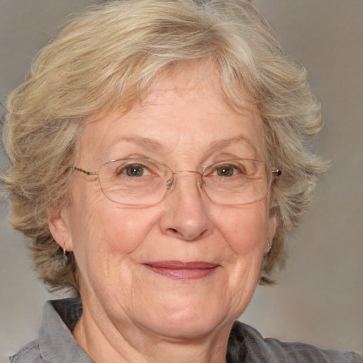 Joyful white middle-aged female with medium  brown hair and brown eyes