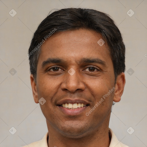 Joyful latino adult male with short  black hair and brown eyes