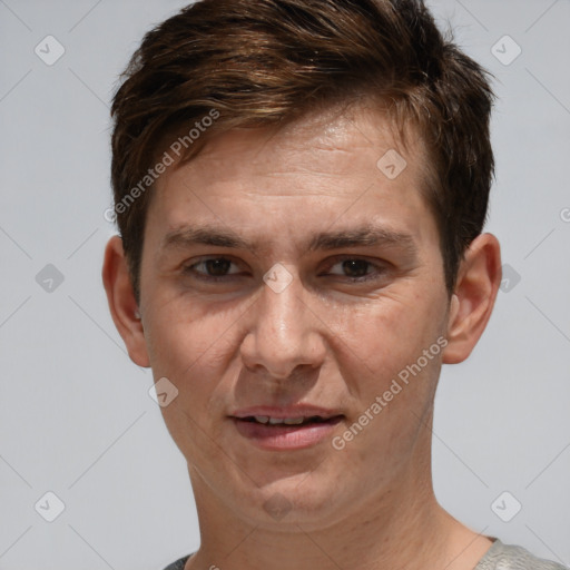 Joyful white adult male with short  brown hair and brown eyes