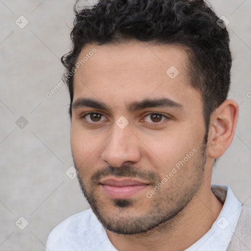 Joyful white young-adult male with short  black hair and brown eyes