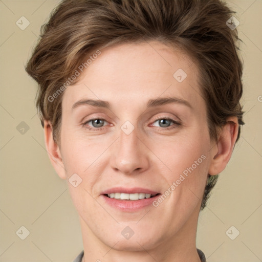 Joyful white young-adult female with short  brown hair and grey eyes