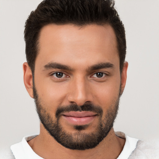 Joyful white young-adult male with short  brown hair and brown eyes