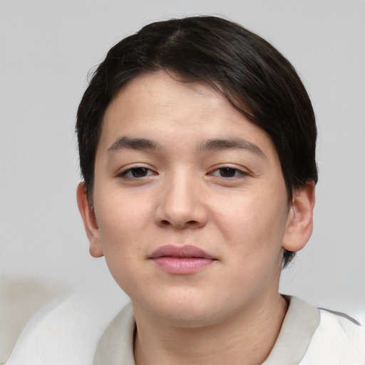 Joyful asian young-adult female with short  brown hair and brown eyes