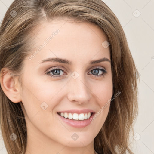 Joyful white young-adult female with long  brown hair and grey eyes