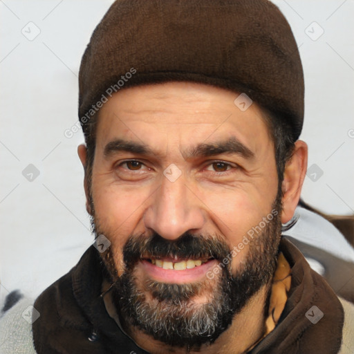 Joyful white adult male with short  black hair and brown eyes