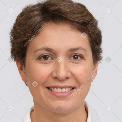 Joyful white adult female with short  brown hair and grey eyes