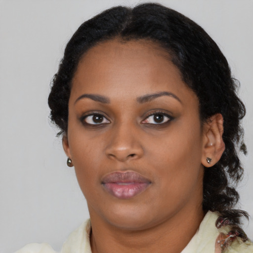 Neutral black young-adult female with medium  brown hair and brown eyes